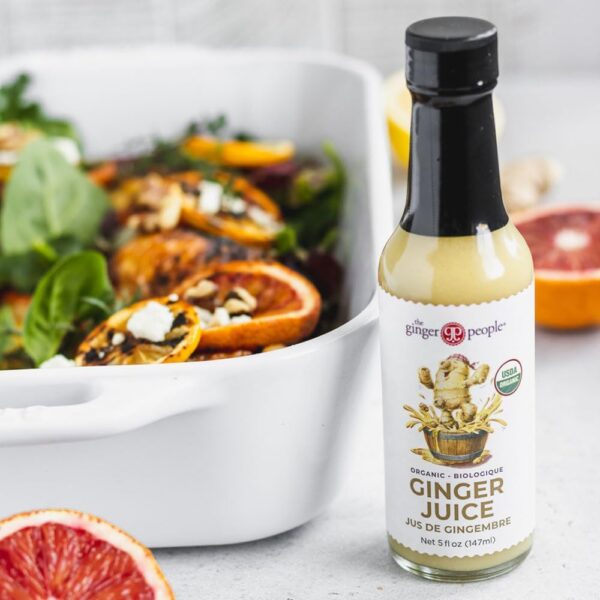 Bottle of The Ginger People Organic Ginger Juice, 100% pure and unsweetened, ideal for cooking, beverages, and wellness shots.