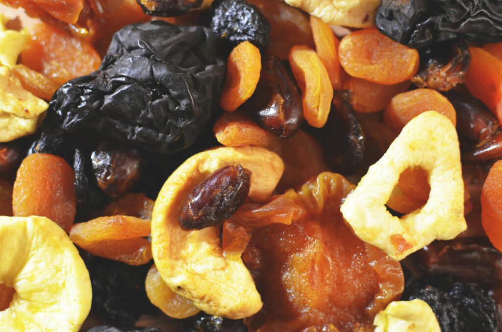 Close-up of a colorful mix of dried fruits and nuts, perfect for healthy snacking.