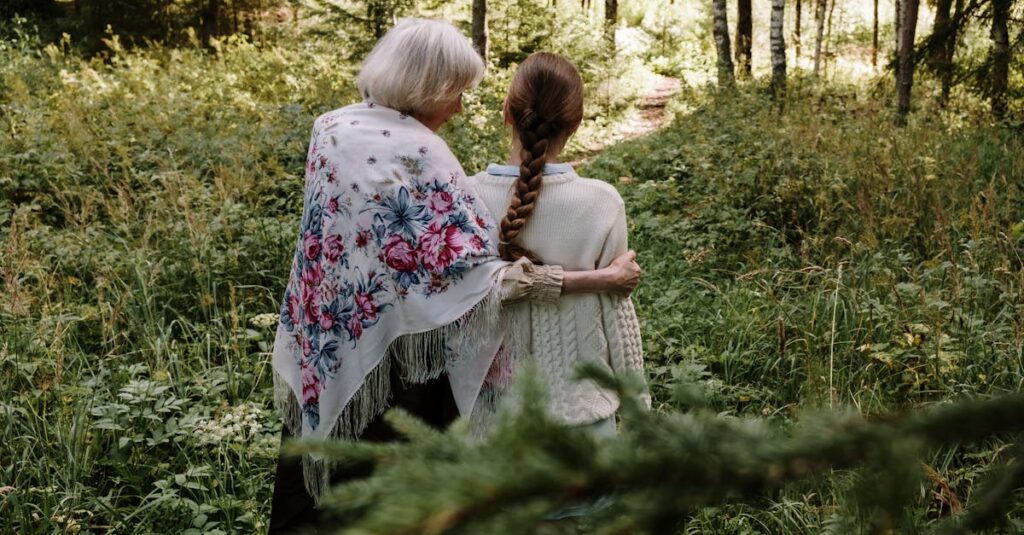 Grandmother and granddaughter walking in a forest, sharing a moment of connection and nature.